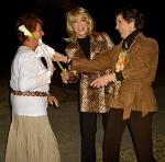 Handing over Jeannie's flower 'bouquet' to friend Carolyn McClain